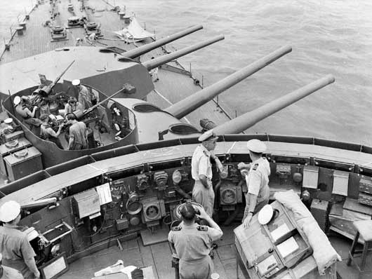 The forward 8-inch turrets of HMAS Australia seeking out the enemy in the South West Pacific Area (AWM 017623).