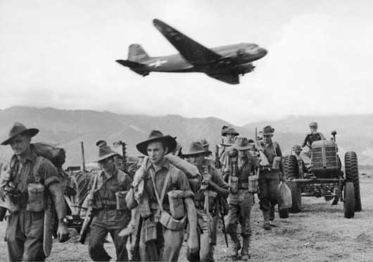 Material being brought in by aircraft as Australian soldiers make their advance on Lae (AWM 015816).