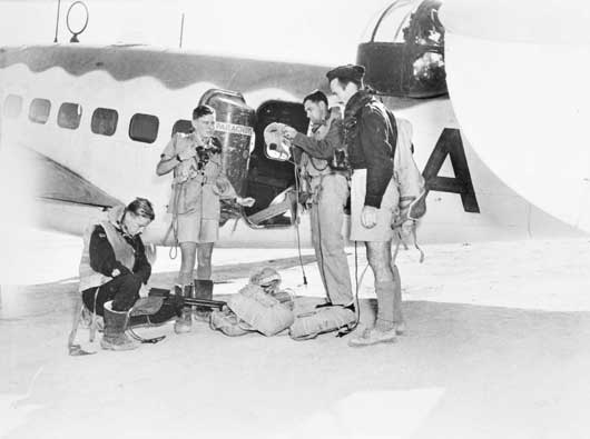 Aircrew of 459 Squadron RAAF check over their gear prior to take-off in their Lockheed Hudson to conduct a covoy patrol over the Mediterranean (AWM MEB0043).