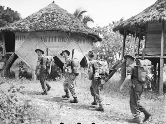 Men of A Company, 14/32nd Infantry Battalion entering Kalampun village (AWM 078376).