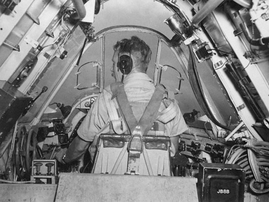 Flight Lieutenant E.M. Ball at the controls of his 30 Squadron Beaufighter during a raid on Witu Island in the Bismarck Sea (AWM P01335.008).