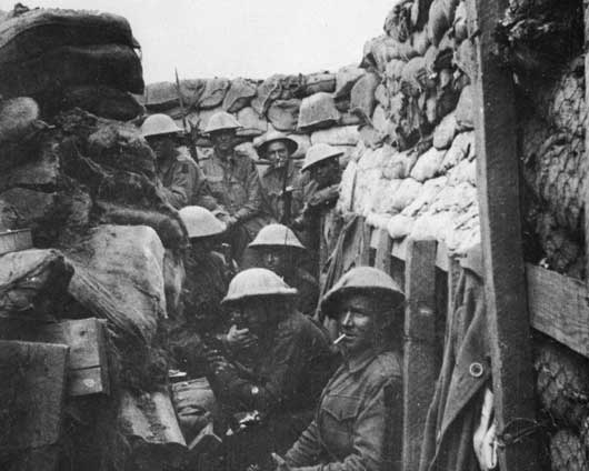 Men of the 53rd Battalion waiting to don their equipment for the attack on Fromelles (AWM A03042).